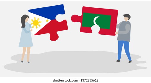 Couple holding two puzzles pieces with Filipino and Maldivian flags. Philippines and Maldives national symbols together.