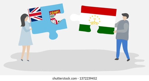 Couple holding two puzzles pieces with Fijian and Tajikistani flags. Fiji and Tajikistan national symbols together.