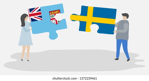 Couple holding two puzzles pieces with Fijian and Swedish flags. Fiji and Sweden national symbols together.
