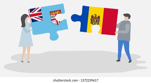 Couple holding two puzzles pieces with Fijian and Moldovan flags. Fiji and Moldova national symbols together.