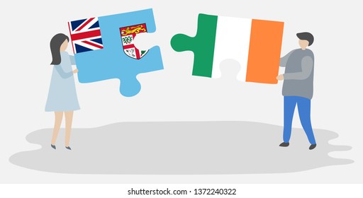 Couple holding two puzzles pieces with Fijian and Irish flags. Fiji and Ireland national symbols together.