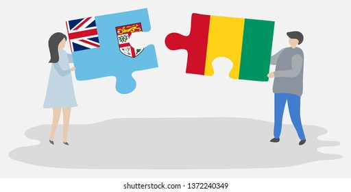 Couple holding two puzzles pieces with Fijian and Guinean flags. Fiji and Guinea national symbols together.