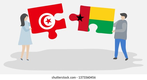 Couple holding two puzzles pieces with Tunisian and Bissau-Guinean flags. Tunisia and Guinea-Bissau national symbols together.