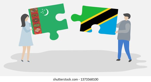 Couple holding two puzzles pieces with Turkmen and Tanzanian flags. Turkmenistan and Tanzania national symbols together.
