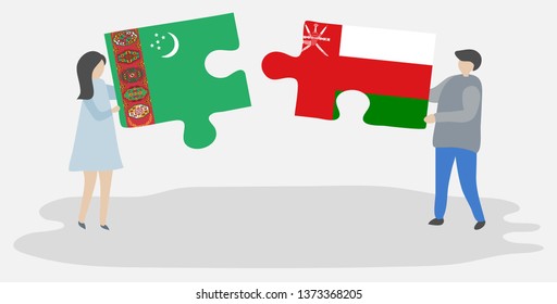 Couple holding two puzzles pieces with Turkmen and Omani flags. Turkmenistan and Oman national symbols together.