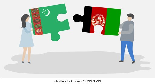 Couple holding two puzzles pieces with Turkmen and Afghan flags. Turkmenistan and Afghanistan national symbols together.
