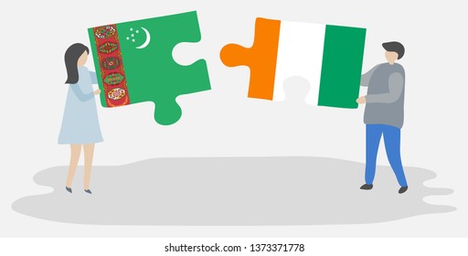 Couple holding two puzzles pieces with Turkmen and Ivorian flags. Turkmenistan and Ivory Coast national symbols together.
