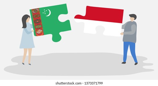Couple holding two puzzles pieces with Turkmen and Indonesian flags. Turkmenistan and Indonesia national symbols together.