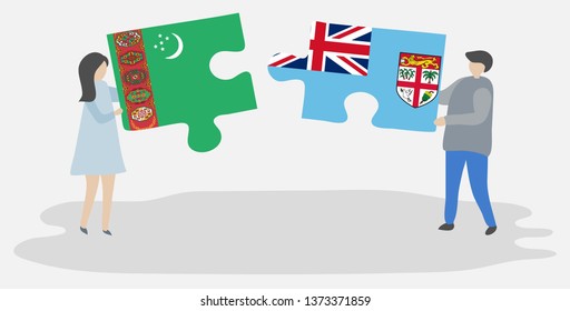 Couple holding two puzzles pieces with Turkmen and Fijian flags. Turkmenistan and Fiji national symbols together.
