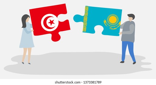 Couple holding two puzzles pieces with Tunisian and Kazakh flags. Tunisia and Kazakhstan national symbols together.