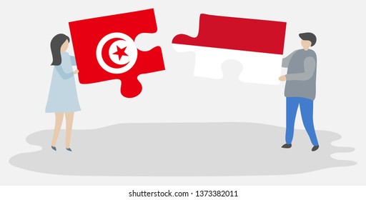 Couple holding two puzzles pieces with Tunisian and Monegasque flags. Tunisia and Monaco national symbols together.