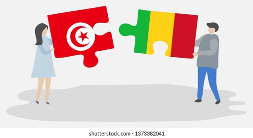Couple holding two puzzles pieces with Tunisian and Malian flags. Tunisia and Mali national symbols together.