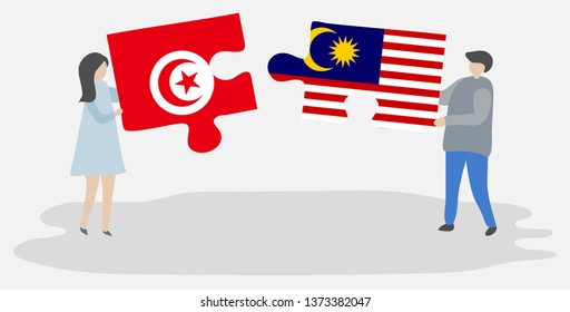 Couple holding two puzzles pieces with Tunisian and Malaysian flags. Tunisia and Malaysia national symbols together.