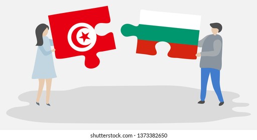 Couple holding two puzzles pieces with Tunisian and Bulgarian flags. Tunisia and Bulgaria national symbols together.