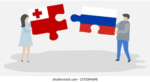 Couple holding two puzzles pieces with Tongan and Russian flags. Tonga and Russia national symbols together.