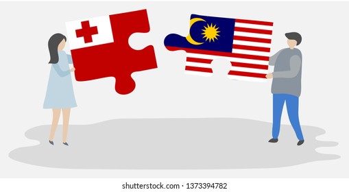 Couple holding two puzzles pieces with Tongan and Malaysian flags. Tonga and Malaysia national symbols together.