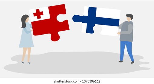Couple holding two puzzles pieces with Tongan and Finnish flags. Tonga and Finland national symbols together.