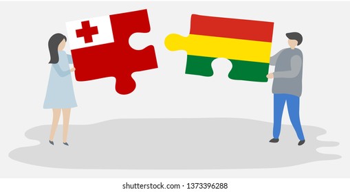 Couple holding two puzzles pieces with Tongan and Bolivian flags. Tonga and Bolivia national symbols together.