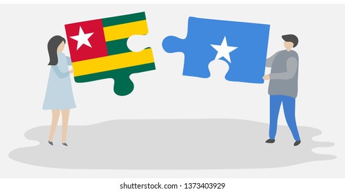 Couple holding two puzzles pieces with Togolese and Somali flags. Togo and Somalia national symbols together.
