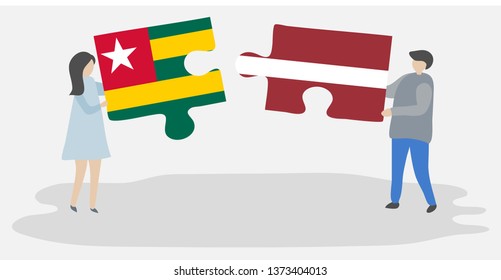 Couple holding two puzzles pieces with Togolese and Latvian flags. Togo and Latvia national symbols together.