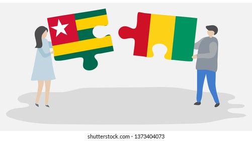Couple holding two puzzles pieces with Togolese and Guinean flags. Togo and Guinea national symbols together.