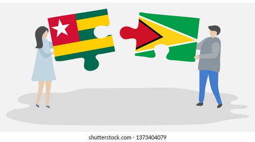 Couple holding two puzzles pieces with Togolese and Guyanese flags. Togo and Guyana national symbols together.