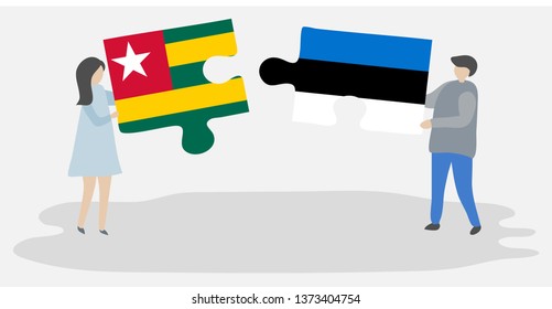 Couple holding two puzzles pieces with Togolese and Estonian flags. Togo and Estonia national symbols together.