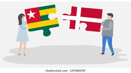 Couple holding two puzzles pieces with Togolese and Danish flags. Togo and Denmark national symbols together.