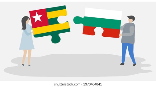 Couple holding two puzzles pieces with Togolese and Bulgarian flags. Togo and Bulgaria national symbols together.