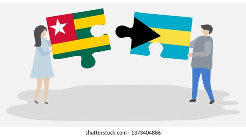 Couple holding two puzzles pieces with Togolese and Bahamian flags. Togo and Bahamas national symbols together.