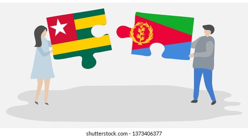 Couple holding two puzzles pieces with Togolese and Eritrean flags. Togo and Eritrea national symbols together.