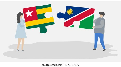 Couple holding two puzzles pieces with Togolese and Namibian flags. Togo and Namibia national symbols together.