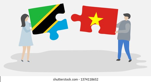 Couple holding two puzzles pieces with Tanzanian and Vietnamese flags. Tanzania and Vietnam national symbols together.