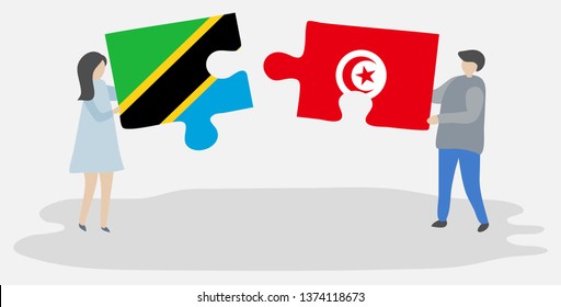Couple holding two puzzles pieces with Tanzanian and Tunisian flags. Tanzania and Tunisia national symbols together.