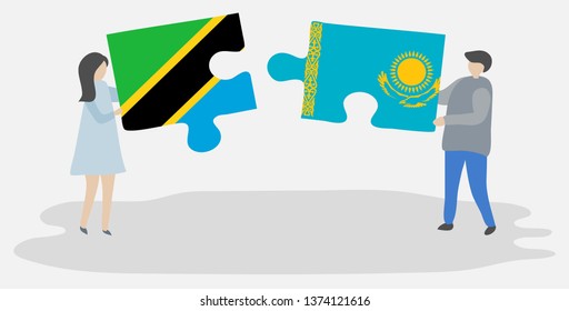 Couple holding two puzzles pieces with Tanzanian and Kazakh flags. Tanzania and Kazakhstan national symbols together.