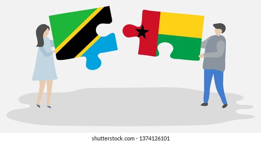 Couple holding two puzzles pieces with Tanzanian and Bissau-Guinean flags. Tanzania and Guinea-Bissau national symbols together.