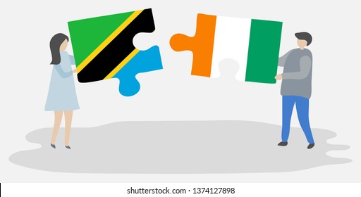 Couple holding two puzzles pieces with Tanzanian and Ivorian flags. Tanzania and Ivory Coast national symbols together.