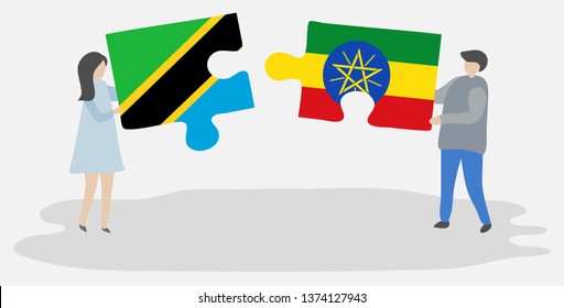 Couple holding two puzzles pieces with Tanzanian and Ethiopian flags. Tanzania and Ethiopia national symbols together.