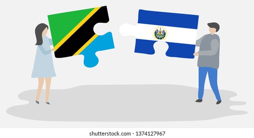 Couple holding two puzzles pieces with Tanzanian and Salvadoran flags. Tanzania and El Salvador national symbols together.