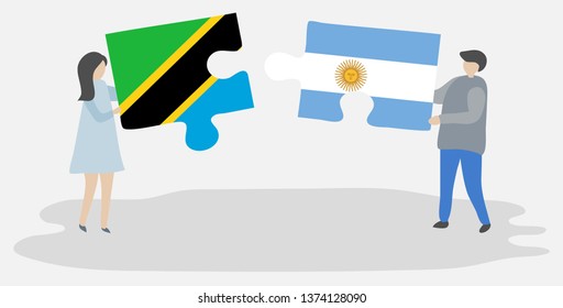 Couple holding two puzzles pieces with Tanzanian and Argentine flags. Tanzania and Argentina national symbols together.
