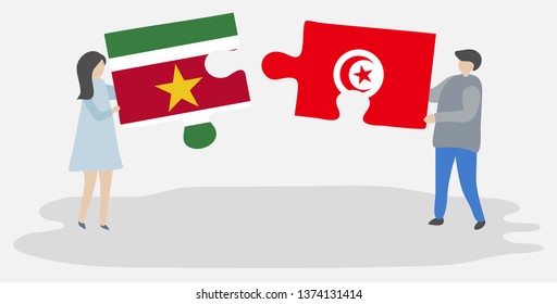 Couple holding two puzzles pieces with Surinamese and Tunisian flags. Suriname and Tunisia national symbols together.