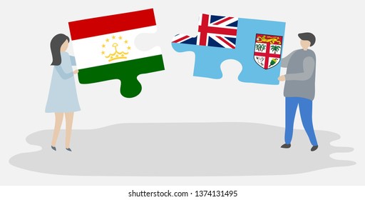 Couple holding two puzzles pieces with Tajikistani and Fijian flags. Tajikistan and Fiji national symbols together.