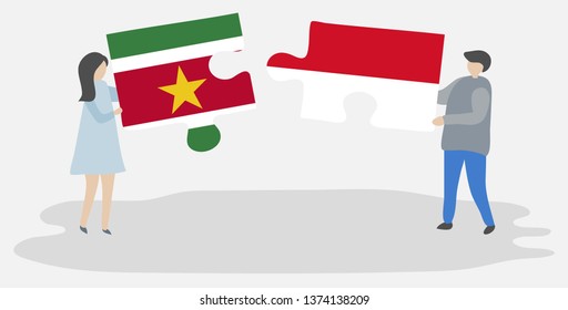 Couple holding two puzzles pieces with Surinamese and Indonesian flags. Suriname and Indonesia national symbols together.
