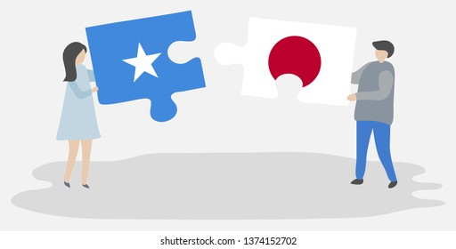 Couple holding two puzzles pieces with Somali and Japanese flags. Somalia and Japan national symbols together.