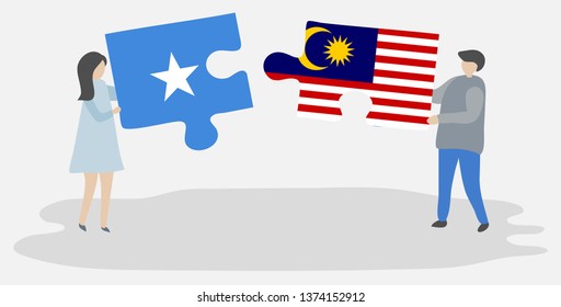 Couple holding two puzzles pieces with Somali and Malaysian flags. Somalia and Malaysia national symbols together.