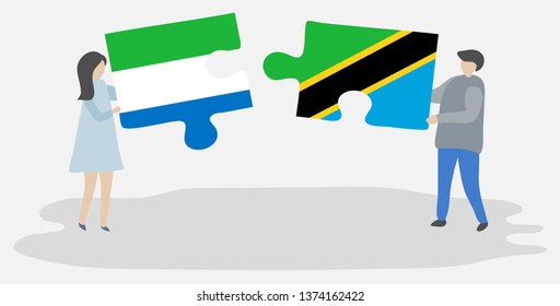 Couple holding two puzzles pieces with Sierra Leonean and Tanzanian flags. Sierra Leone and Tanzania national symbols together.