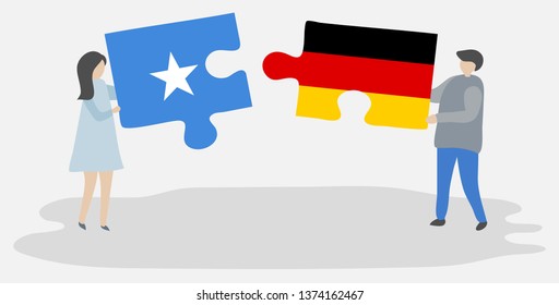 Couple holding two puzzles pieces with Somali and German flags. Somalia and Germany national symbols together.