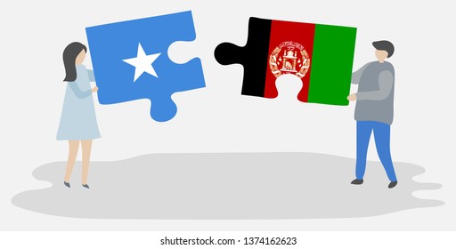Couple holding two puzzles pieces with Somali and Afghan flags. Somalia and Afghanistan national symbols together.