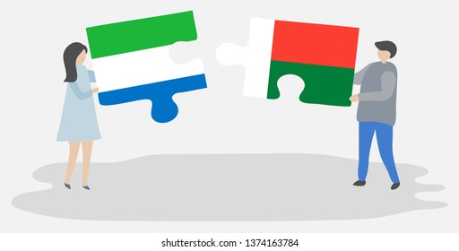 Couple holding two puzzles pieces with Sierra Leonean and Malagasy flags. Sierra Leone and Madagascar national symbols together.