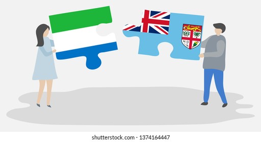 Couple holding two puzzles pieces with Sierra Leonean and Fijian flags. Sierra Leone and Fiji national symbols together.